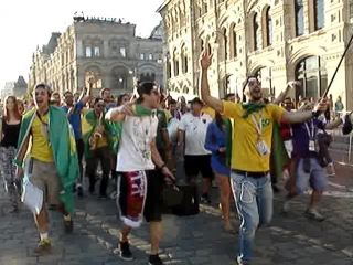 with songs and dances, brazilian fans stroll through red square. torcida brasileira na pra a vermelha em moscou